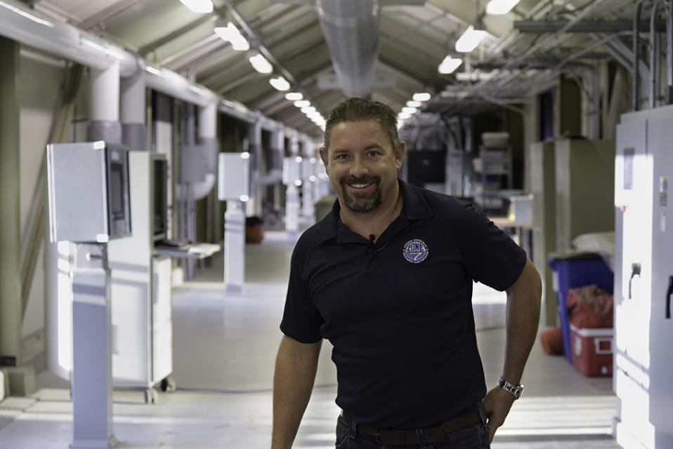 Zone 7 Employee smiling with hand on his hip at Del Valle Water Treatment Plant