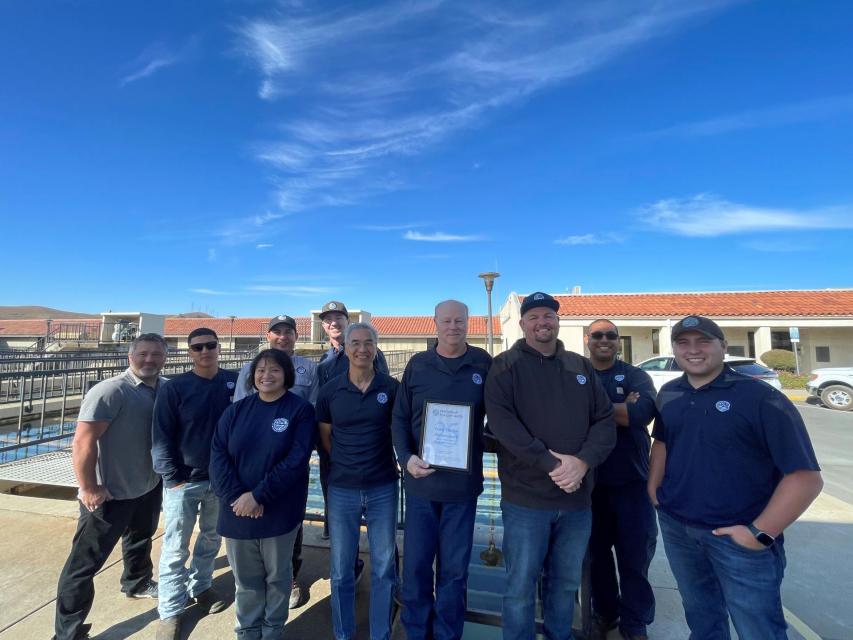 Zone 7 staff proudly display the 25-Year Directors Award at the Del Valle Water Treatment Plant