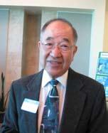 Mun Marr, Zone 7 Water Agency's first general manager, pictured smiling at an event with nametag and glasses