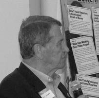 Richard Karn, former principal engineer at Zone 7 water Agency, pictured speaking into a microphone and wearing a nametag
