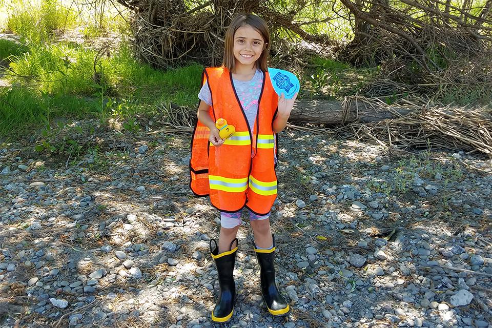 Child happily participating in watershed lesson