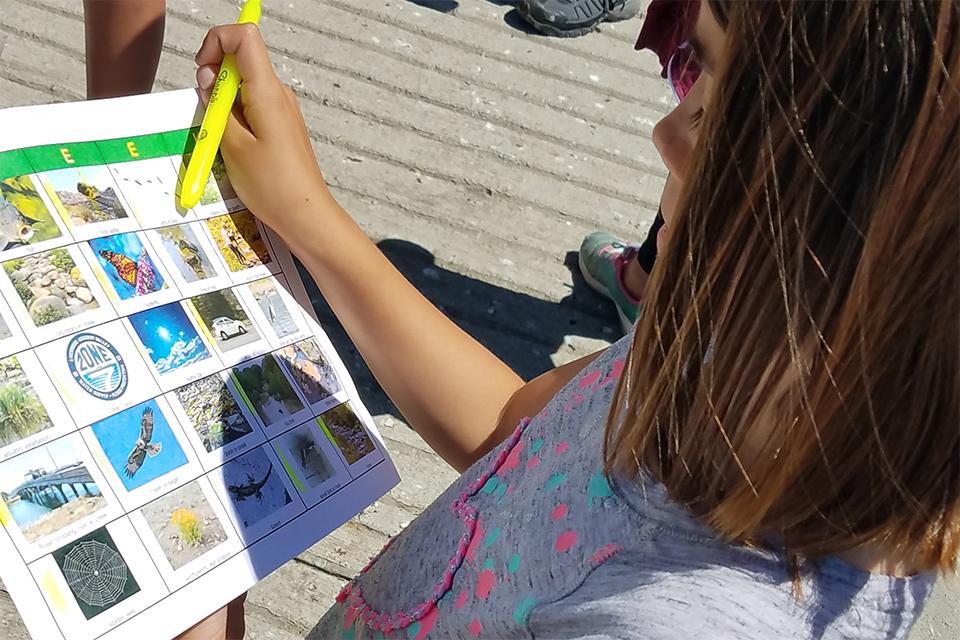 Child participating in an outdoor watershed activity